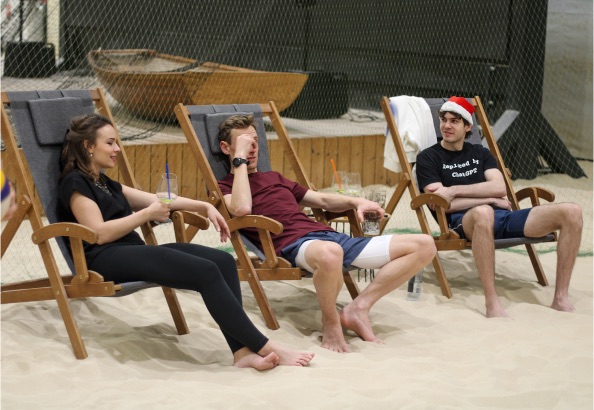 Team in deck chairs at the indoor beach