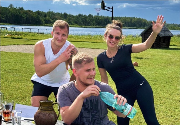 Team members relaxing outside at the summer retreat