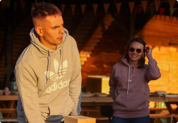 Team members by the fire in the evening